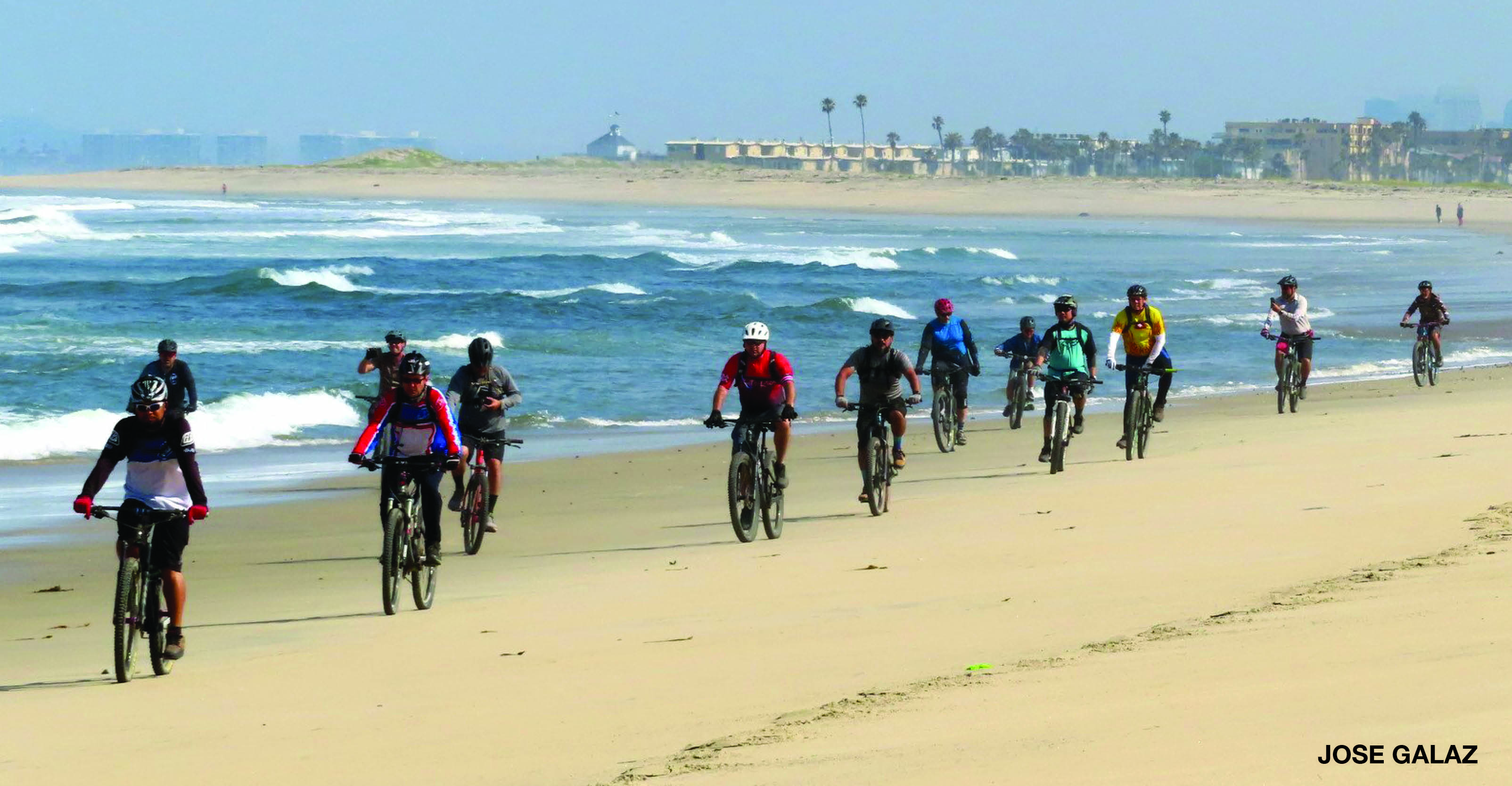people on bikes at the beach